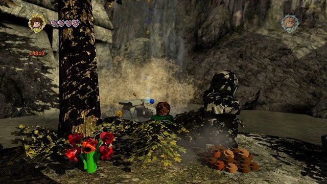 Wystarczy podejść do znajdującego się na środku pokoju sztandaru i aktywować go - Bonusowy poziom | Śródziemie | LEGO The Lord of the Rings - LEGO The Lord of the Rings: Władca Pierścieni - poradnik do gry