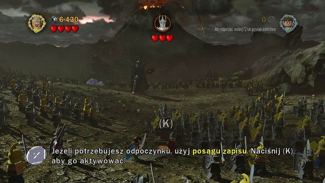 Zanim ruszymy w kierunku Władcy Ciemności możemy skorzystać ze stojącego obok nas posągu, aby zapisać stan gry (K) - Prolog | Opis przejścia - Akt I | LEGO The Lord of the Rings - LEGO The Lord of the Rings: Władca Pierścieni - poradnik do gry