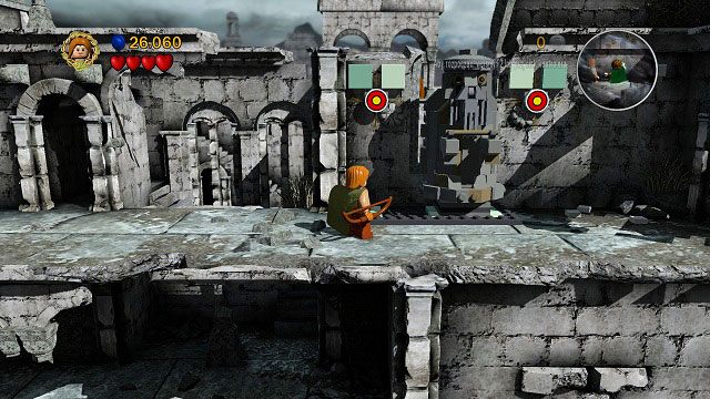 Po wejściu schodami na piętro strzelamy do dwóch tarcz, korzystając z kafelków uzupełniamy posadzkę i przesuwamy kolumnę w lewo - Osgiliath | Opis przejścia - Akt II | LEGO The Lord of the Rings - LEGO The Lord of the Rings: Władca Pierścieni - poradnik do gry