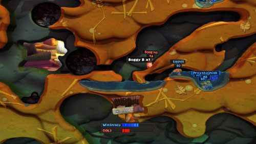 Gdy zgromadzimy sporą grupę przeciwników w tunelu, ruszamy zebrać skrzynkę z Boggym B [ilustracja] - Nasiona zniszczenia | Podwórko (Kampania) | Worms Revolution - Worms: Revolution - poradnik do gry