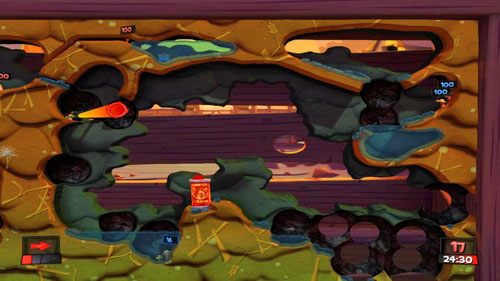 Przeciwnicy po lewej stronie od pojemnika z benzyną powinni się sami utopić (możemy im pomóc Granatem) - to, na czym powinniśmy się skupić, to ostrzał z Bazooki w kierunku dwóch wrogów znajdujących się nad zbiornikiem wodnym z prawej strony mapy [ilustracja] - Zbierz plony | Podwórko (Kampania) | Worms Revolution - Worms: Revolution - poradnik do gry