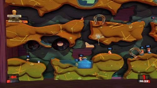 Jeśli wrogowie nie zniszczyli skrzynki z Dynamitem (w zbiorniku wodnym po lewej), a jedynie przebili zbiornik tak, że skrzynka spadła, wykorzystujemy jeden z Plecaków odrzutowych by po nią polecieć i wrócić na górę skąd zrzucamy zdobyty Dynamit na naczynie [ilustracja] - Kosiarz | Podwórko (Kampania) | Worms Revolution - Worms: Revolution - poradnik do gry