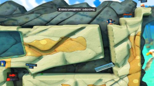Przeskakujemy wąską szczelinę, a następnie, postawiwszy w odpowiedni sposób Belkę [ilustracja], wrzucamy do wspomnianej szczeliny Elektromagnes z opcją odpychaj - dzięki temu jeden z nieprzyjaciół spadnie z półki skalnej, tracąc około połowy życia - Plaża | Łamigłówki | Worms Revolution - Worms: Revolution - poradnik do gry