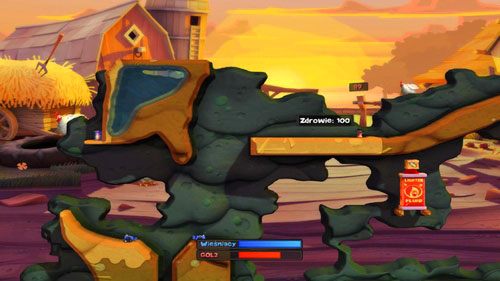 By dostać się na półkę poniżej miejsca startu, musimy zeskoczyć ze skarpy mając przygotowany Młot pneumatyczny, a następnie uruchomić go (SPACJA), gdy tylko nasz robal znajdzie się nad wspomnianą półką - Podwórko | Łamigłówki | Worms Revolution - Worms: Revolution - poradnik do gry