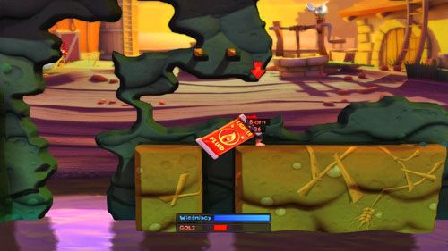 Następnie korzystając z Telekinezy, celujemy w pojemnik z paliwem i przestawiamy go tak, by nie spadł do wody [ilustracja] - przy pomocy klawisza TAB możemy obracać przedmiot przed przeniesieniem - Podwórko | Łamigłówki | Worms Revolution - Worms: Revolution - poradnik do gry