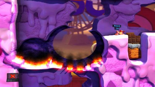 Dzięki odpowiedniemu ułożeniu tuby, nasz nieprzyjaciel zostanie wyrzucony na wzniesienie, na którym się znajdujemy - Wszystkie atrakcje wesołego miasteczka! | Łamigłówki | Worms Revolution - Worms: Revolution - poradnik do gry