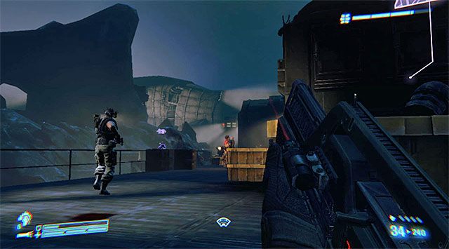 W zależności od upodobań możesz przejść przez wspomniany wyżej budynek (powinny się w nim znajdować jakieś zapasy) lub pozostać na głównej ścieżce - Znajdź i uratuj pojmanego marine | Misja 8 - Wał obronny - Aliens: Colonial Marines - poradnik do gry