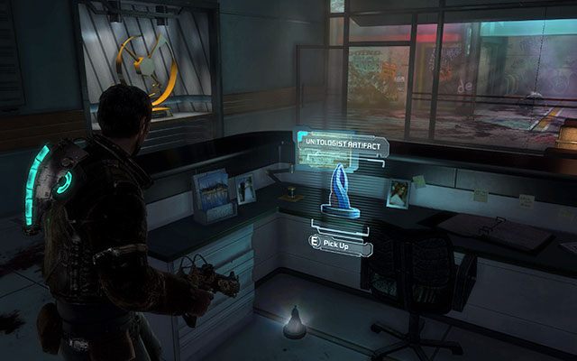 Po wyeliminowaniu Nekromorfów w dwóch pomieszczeniach, kiedy zjedziesz windą na dół zerknij pod biurko po prawej stronie zaraz przy drzwiach windy - znajdziesz tam artefakt - Rozdział 1 | Sekrety | Dead Space 3 - Dead Space 3 - poradnik do gry