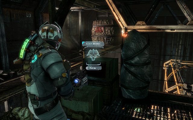 Po wyjściu po drabinie zaraz przed drzwiami prowadzącymi do ogromnej hali z kontenerami - Rozdział 5 | Sekrety | Dead Space 3 - Dead Space 3 - poradnik do gry