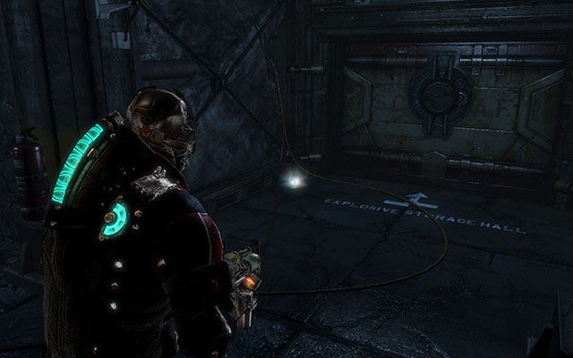W narożniku, tuż przy jednych z zamkniętych wrót, w pomieszczeniu z windą towarową i zaopatrzeniem - Rozdział 14 (2) | Sekrety | Dead Space 3 - Dead Space 3 - poradnik do gry