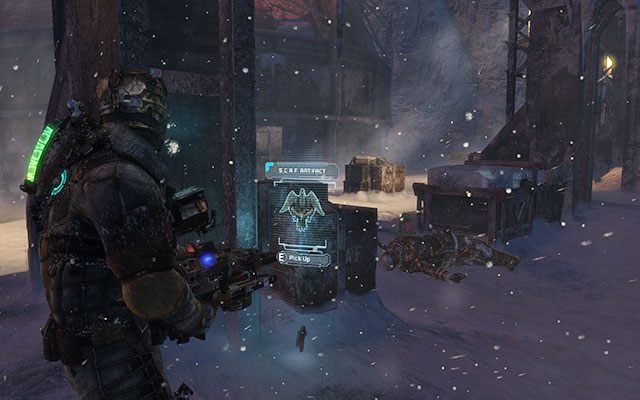 Za jednym z filarów, zaraz obok skrzyń, po prawej, tuż przed wejściem do placówki - Rozdział 10 | Sekrety | Dead Space 3 - Dead Space 3 - poradnik do gry