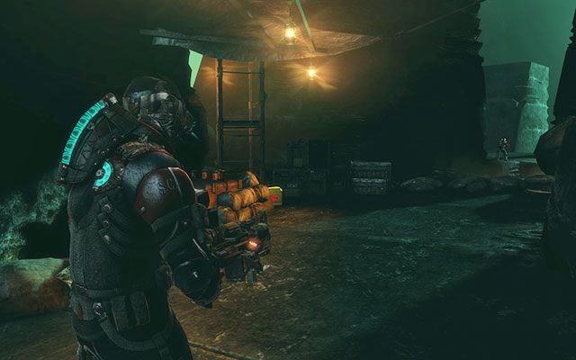 Przed zablokowanym dwoma głazami przejściem, po lewej stronie między zaopatrzeniem - Rozdział 17 | Sekrety | Dead Space 3 - Dead Space 3 - poradnik do gry