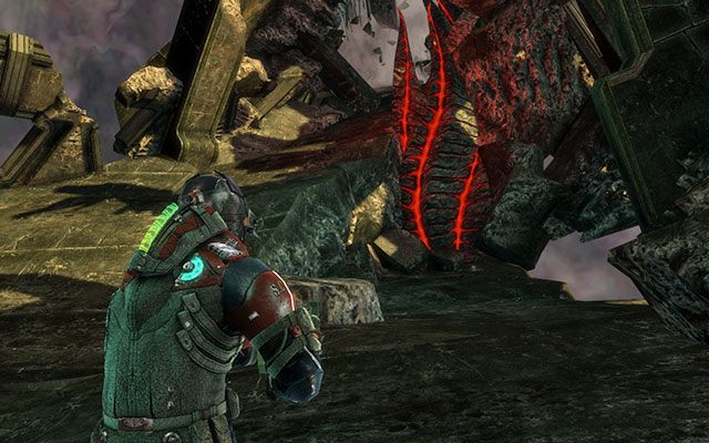 Po dotarciu do pierwszych dwóch macek , po zejściu ze wzniesienia, skręć w lewo - artefakt leży na ziemi - Rozdział 19 | Sekrety | Dead Space 3 - Dead Space 3 - poradnik do gry