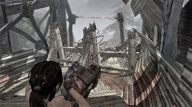 Kolejny ważny krok to użycie strzelby do zniszczenia barykady - Wybierz się do obozu rozbitków | 20 - Szybka droga na dół | Solucja Tomb Raider - Tomb Raider - poradnik do gry