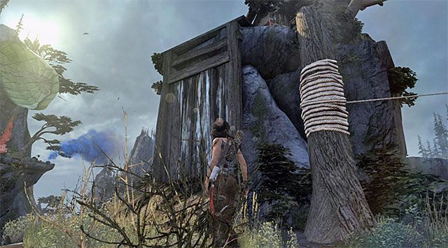 Zjedź po linie i następnie zlokalizuj pokazaną na dołączonym screenie ścianę, którą musisz użyć do dotarcia na wyżej położoną skalną półkę - Dotrzyj do sygnału dymnego | 10 - Nieczyste sumienie, 11 - Kolejny bałagan - Tomb Raider - poradnik do gry