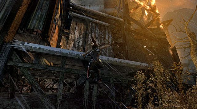Obróć się w prawo, przystępując do wspinaczki w pokazanym na screenie miejscu - Ucieknij z bazy Solarii | 17 - Prosto w ogień | Solucja Tomb Raider - Tomb Raider - poradnik do gry