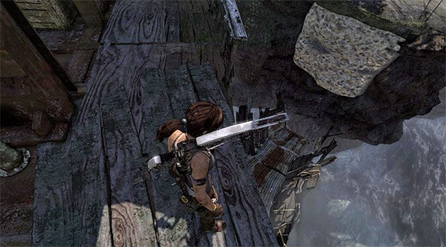 Przejdź po metalowych belkach, docierając na jeden z niższych poziomów wraku - Dotrzyj do wraku okrętu Endurance (1) | 22 - Zaginiony | Solucja Tomb Raider - Tomb Raider - poradnik do gry
