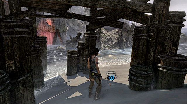 Dokłądnie zbadaj obszar pod mostkiem, dzięki czemu natrafisz na leżący na piasku pojemnik (nagroda: 5 punktów doświadczenia) - Geoskrzynki (01 - 07) | Sekrety - Shipwreck Beach (Plaża wraków) | Tomb Raider - Tomb Raider - poradnik do gry