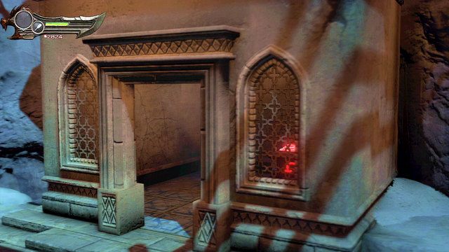 Zeskocz na ziemię i wejdź na parter odwiedzonego przed chwilą budynku - Początek wioski (2) - God of War: Ascension - poradnik do gry