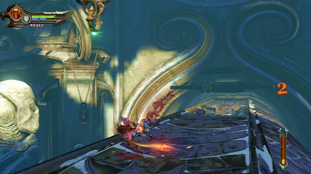 Pierwszy etap podróży zakończy się, gdy wąż zacznie wjeżdżać do wąskiego zdobionego tunelu, a po lewej stronie będzie można dostrzec świecący na zielono punkt zaczepiania - Przejażdżka fioletowym pytonem | God of War Wstąpienie - God of War: Ascension - poradnik do gry