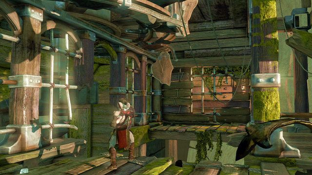 We wnętrzu posągu podejdź kilka kroków w lewo i z krawędzi złap za podwieszone pod sufitem koło - Wnętrze posągu | God of War Wstąpienie - God of War: Ascension - poradnik do gry