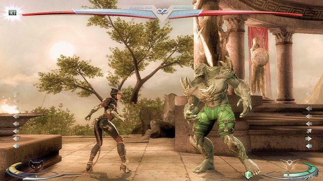 Na lewym krańcu areny znajduje się misa z płomieniem - Injustice: Themyscira - arena - Injustice Gods Among Us - poradnik do gry