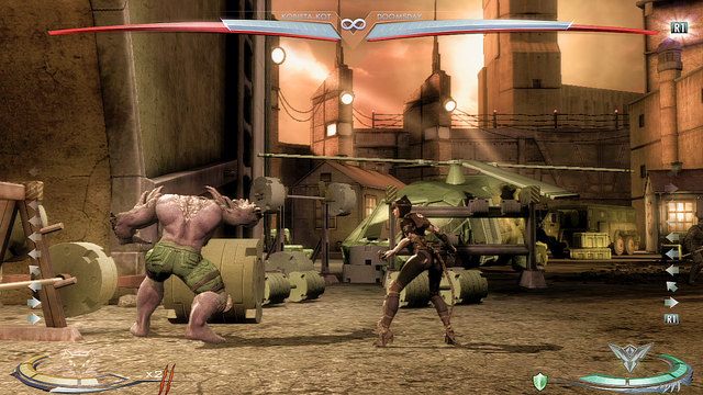 Na lewym krańcu areny znajduje się sztanga - Injustice: Wyspa Strykera - arena - Injustice Gods Among Us - poradnik do gry