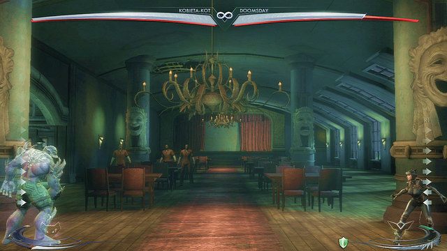 Po prawej stronie areny znajduje się żyrandol, aby z niego skorzystać należy podskoczyć - Injustice: Arkham Asylum, Azyl Jokera - arena - Injustice Gods Among Us - poradnik do gry
