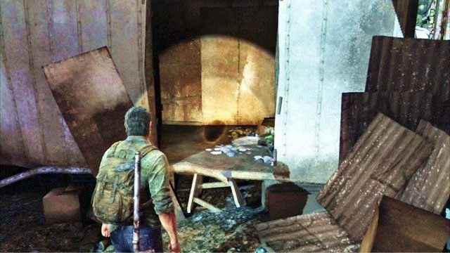 Po przeskoczeniu przez blokującą drogę ciężarówkę, odwróć się i wejdź do przyczepy - Peryferia | Artefakty i nieśmiertelniki w The Last of Us - The Last of Us - poradnik do gry
