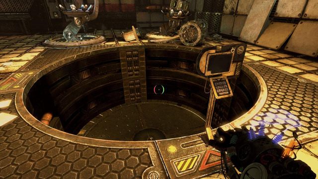Podejdź do okrągłego czarnego włazu, znajdującego się na środku pomieszczenia - Hidden Lab | Akt II | Magrunner Dark Pulse - Magrunner: Dark Pulse - poradnik do gry