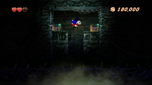 Niektóre zakamarki można z łatwością pominąć (a zwłaszcza przy niskiej jasności w opcjach). - Główne korytarze, mury i lochy | Transylwania | DuckTales - DuckTales Remastered - poradnik do gry