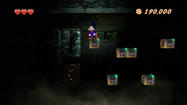 Uwaga! Należy uważać z zbyt pochopnym niszczeniem lewitujących kufrów, mogą one bowiem stanowić jedyną platformę, dzięki której możemy dostać się do ukrytych, trudno dostępnych miejsc. - Główne korytarze, mury i lochy | Transylwania | DuckTales - DuckTales Remastered - poradnik do gry