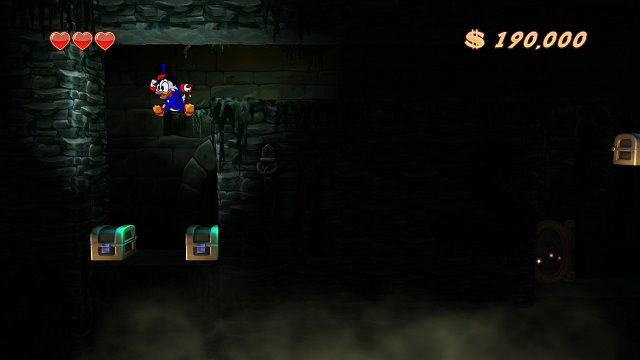 Nie, to nie jest przepaść. Skrzynki stoją na podłożu, chociaż przy wszechobecnych ciemnościach można by było stwierdzić inaczej. - Główne korytarze, mury i lochy | Transylwania | DuckTales - DuckTales Remastered - poradnik do gry