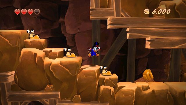 Ślimaki nie dość, że są wyjątkowo obślizgłe to jeszcze zadają nam obrażenia. - Wejście do kompleksu | Afrykańskie kopalnie | DuckTales - DuckTales Remastered - poradnik do gry