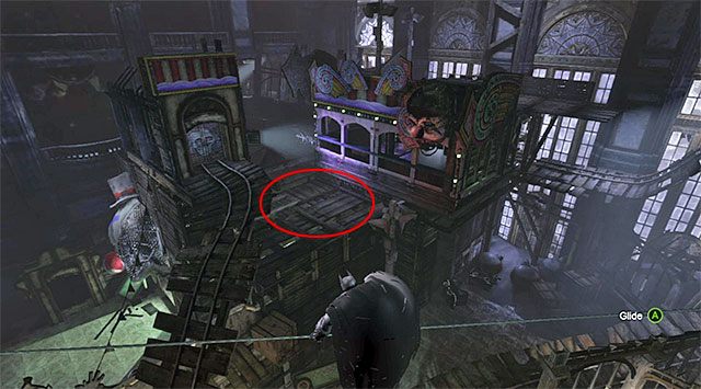 Doprowadź do rozwinięcia liny z wykorzystaniem zaczepu, tej samej, którą normalnie wykorzystuje się do awansowania do kolejnej lokacji - Plik z danymi 17 (Dzielnica brylantów) - Batman: Arkham Origins - poradnik do gry