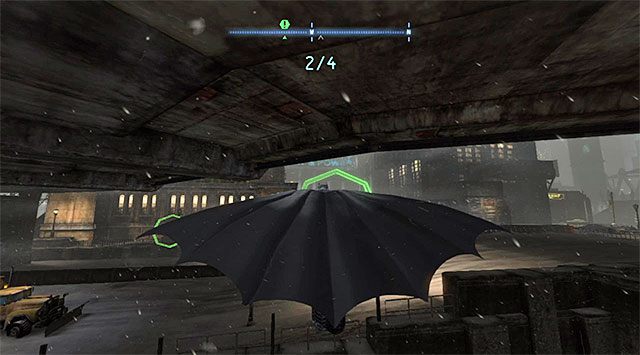 Poszybuj w stronę obręczy zlokalizowanej po lewej stronie, przy czym po drodze dokonaj już odpowiednich korekt toru lotu, tak by zwrócić się w stronę prawego mostu - System Mrocznego Rycerza - Batman: Arkham Origins - poradnik do gry