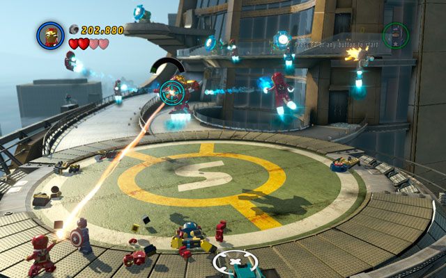 Walka z opancerzonym Mandarynem polega na ustawicznym ostrzale - należy cały czas strzelać do przeciwnika, dopóki pasek jego odporności nie spadnie do 10% - Mandaryn i Aldrich Killian | Bossowie w LEGO Marvel Super Heroes - LEGO Marvel Super Heroes - poradnik do gry