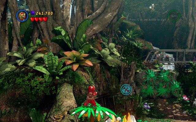 Trzeci postawiono na skarpie, nad ogniskiem z jajami, przy którym uwięziony jest Stan Lee - Rapturous Rise | Zestawy MiniKit w LEGO Marvel Super Heroes - LEGO Marvel Super Heroes - poradnik do gry