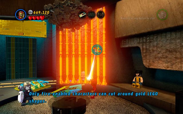 Chcąc uratować Stana Lee musisz podejść do prawej strony pomieszczenia, przepalając złotą kratę przy pomocy gorącego promienia - Bonusowe poziomy Deadpoola | Stan Lee w opałach | LEGO Marvel Super Heroes - LEGO Marvel Super Heroes - poradnik do gry