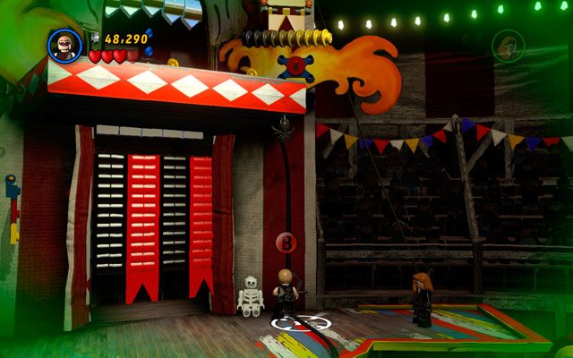 Będąc u góry strzel Hawkeyem w otwór u góry, tworząc linę dla pozostałych postaci - Stunt Show Surprise | Bonusowe misje Deadpoola | LEGO Marvel Super Heroes - LEGO Marvel Super Heroes - poradnik do gry