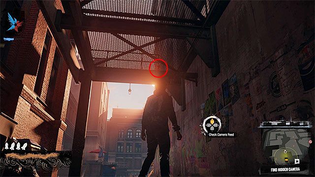 3) Ukryta kamera (Hidden Camera) - Poszukiwana kamera znajduje się w pokazanym na powyższym screenie miejscu - Market District - Trudniejsze aktywności - Miasto - inFamous: Second Son - poradnik, opis przejścia, miasto 
