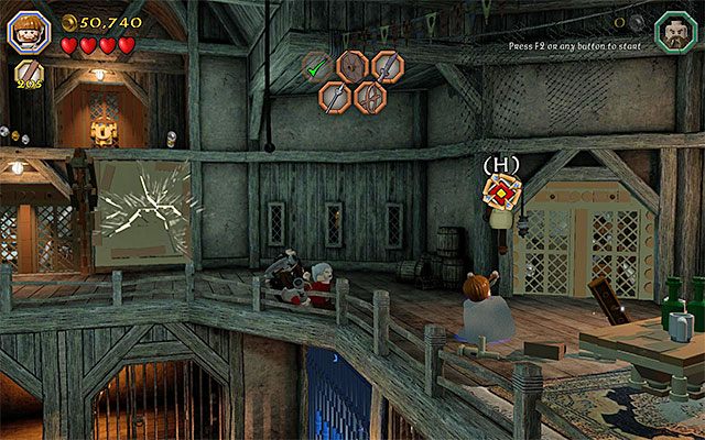 Używaj procy na tarczy do momentu całkowitego podniesienia kraty - Etap 12 (A Warm Welcome) - Zbrojownia - LEGO The Hobbit - poradnik do gry