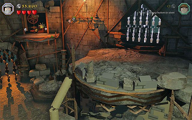 Do półki z drugim pokrętłem dotrzesz chwytając się bocznej krawędzi - Etap 14 (The Necromancer) - Wnętrze twierdzy - LEGO The Hobbit - poradnik do gry