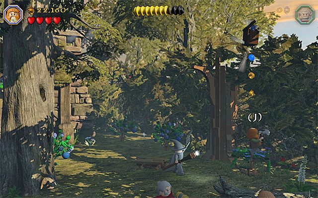 Zacznij odbijać się od trampoliny, doskakując docelowo do minizestawu - Etap 9 (Queer Lodgings) - LEGO The Hobbit - poradnik do gry