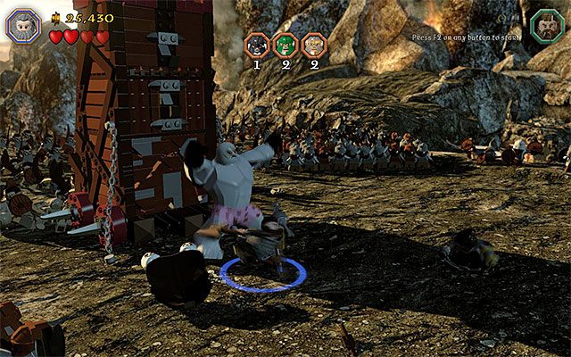 Atakowaniem dużego orka muszą zajmować się dwa krasnoludy działające w kooperacji - Etap 3 (Azog the Defiler) - Bitwa z orkami - LEGO The Hobbit - poradnik do gry