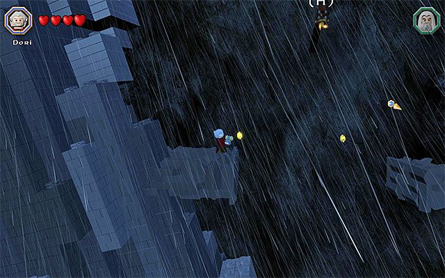 Po dotarciu do końcowej części kamiennego olbrzyma zacznij ostrożnie zeskakiwać na niżej położone platformy - Białe pytajniki - opisy przejścia zadań (61-80) - LEGO The Hobbit - poradnik do gry