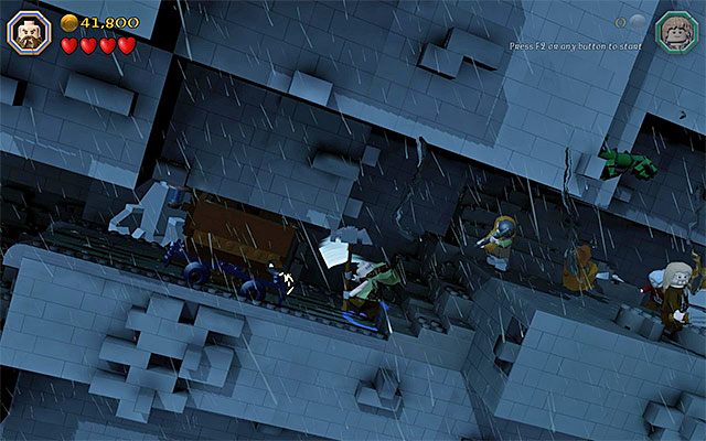 Użyj młota żeby popchnąć wagonik - Etap 6 (Over Hill and Under Hill) - Wspinaczka po kamiennym olbrzymie - LEGO The Hobbit - poradnik do gry