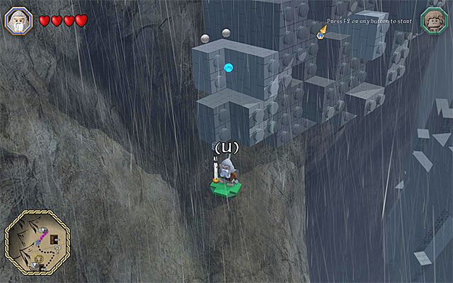 Wznów przemarsz wąską górską ścieżką - Śródziemie - Dotarcie do miejsca schronienia się przed burzą - LEGO The Hobbit - poradnik do gry