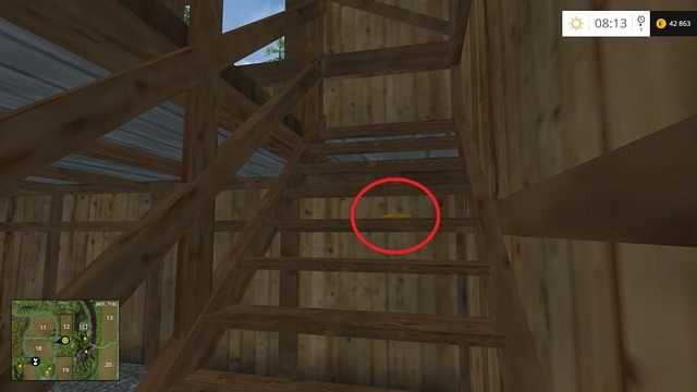 Na schodach, wewnątrz drewnianego budynku znajdującego się tuż przy drodze - Sektor C: monety 30 - 44 | Złote monety w Farming Simulator 15 - Farming Simulator 15 - poradnik do gry