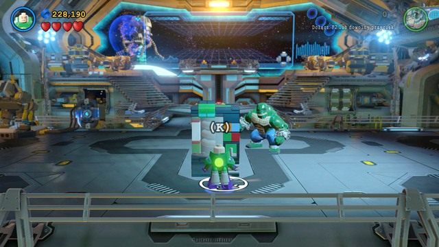 Po wyciągnięciu panelu, zmień postać na Luthora i przejdź do centralnej części pomieszczenia - Na Strażnicy Porządku | Opis przejścia Lego Batman 3 Poza Gotham - LEGO Batman 3: Poza Gotham - poradnik do gry